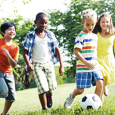 kids playing soccer neighborhood management lifestyle activity