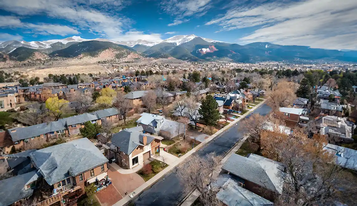 Lafayette CO Community Management Company - aerial view of beautiful-homes with Rockies backdrop